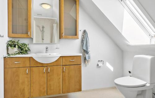 a bathroom with a sink and a toilet at 6 Bedroom Stunning Home In Højer in Højer
