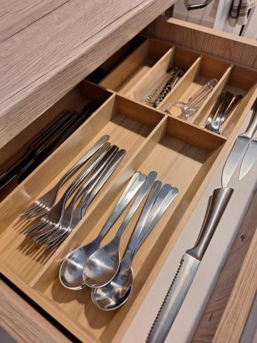 a drawer with silver utensils in a kitchen at Apartman Lory, Zagreb, Downtown, with own parking in the garage in Zagreb