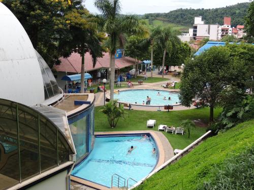 a view of a swimming pool in a resort at Suite na Morada do Sol in Piratuba