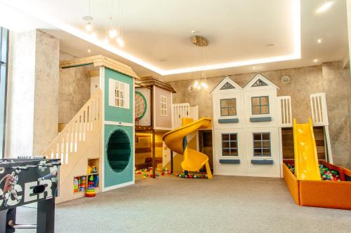 a play room with a slide and a slideintend at Rest&Ski Spa Resort in Bukovel