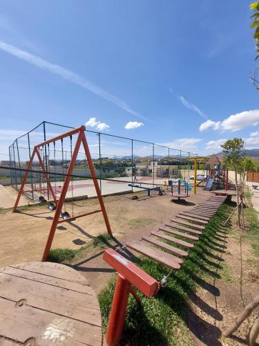a park with a bench and a swing set at LA GRANJA in Tetouan