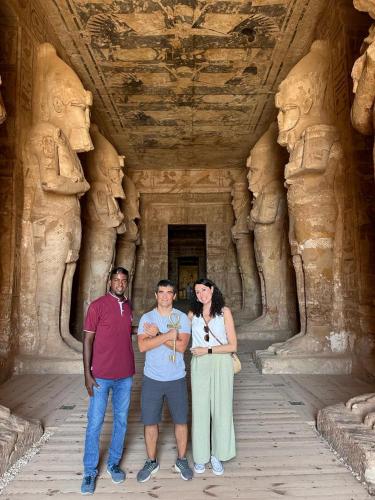 a group of three people standing in a temple at Five Star Nile Cruise from Aswan to Luxor in Aswan