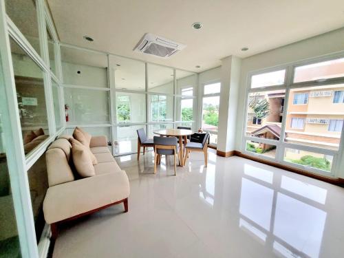 a living room with a couch and a table at CONDO unit in Puerto Princesa Palawan in Puerto Princesa City