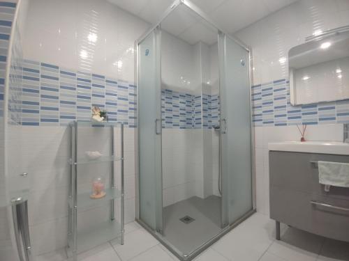 a bathroom with a shower and a sink at La Mata apartment on the first line in La Mata