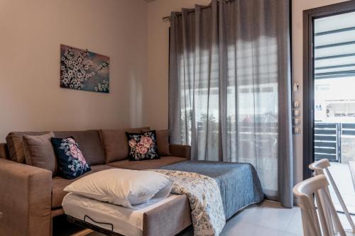 Ένα ή περισσότερα κρεβάτια σε δωμάτιο στο Filion Apartments Nafplio