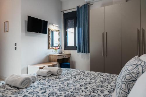 Ένα ή περισσότερα κρεβάτια σε δωμάτιο στο Filion Apartments Nafplio