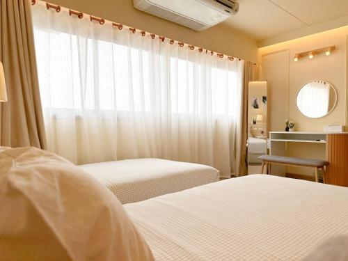 Katil atau katil-katil dalam bilik di ห้องพักเมืองทองธานี Happiness Sleep P1