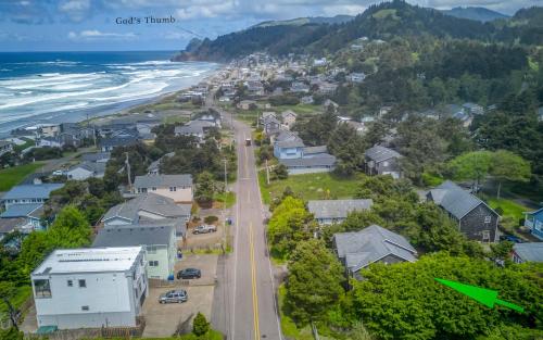 an aerial view of a coastal town with the ocean at The Mermaid in Lincoln City