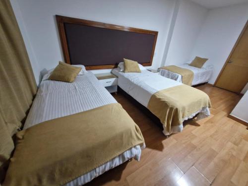 Cama o camas de una habitación en Hotel Dorado Ferial