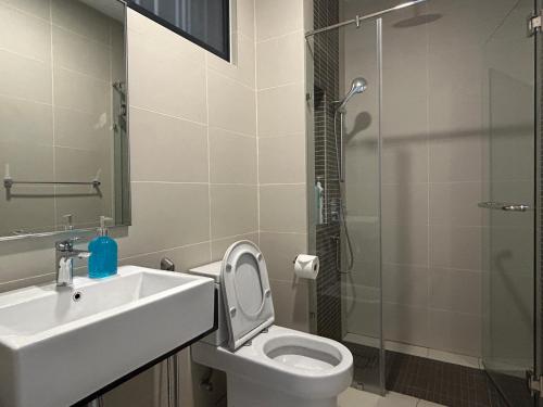 a bathroom with a sink and a toilet and a shower at SS KL Sentral by NomadNest in Kuala Lumpur