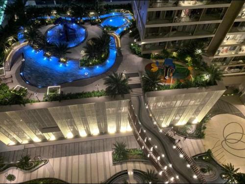 an overhead view of a building with a swimming pool at The Sóng Vũng Tàu Homestay - Suri's Apartment in Vung Tau