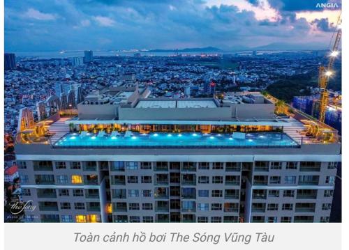 a building with a swimming pool on top of it at The Sóng Vũng Tàu Homestay - Suri's Apartment in Vung Tau