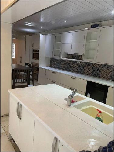 a kitchen with a sink and a counter top at Smart Large Room with disabled facilities Idealy Located near Doncaster - Rotherham -Sheffield in Rotherham