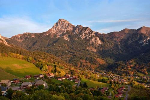 a small town in a valley with a mountain at Chalet Altitude - Vue panoramique - 8 pers in Bernex