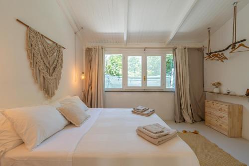 Voodi või voodid majutusasutuse Villa Morea & Rooms in Procida toas