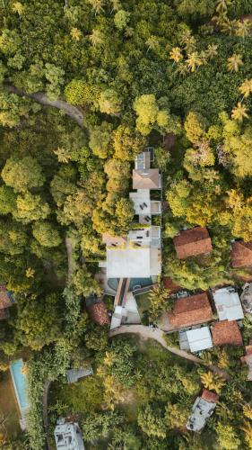 an overhead view of a house in a forest at The Nine Mirissa in Mirissa