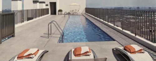 a swimming pool on the balcony of a building at Best Apartment Rental Estación Central in Santiago