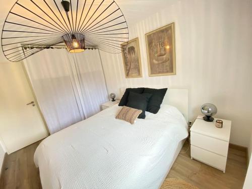 Katil atau katil-katil dalam bilik di Appartement avec jardin privé à Duingt