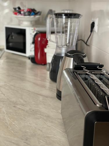 a kitchen with a blender and a counter top at Casa Baldassini in Aulla