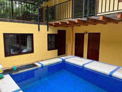 a swimming pool in the middle of a building at Casa Tahoe Home Stay Playa Pita, Costa Rica in Tarcoles