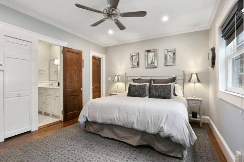 a bedroom with a bed and a ceiling fan at Piedmont Park Pool-Side Retreat in Atlanta