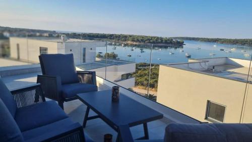 a view of a balcony with a view of a harbor at Panorama in Medulin