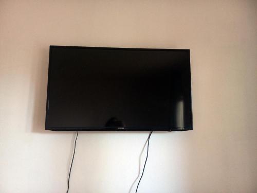 a flat screen tv hanging on a wall at Villa Marija in Novi Vinodolski