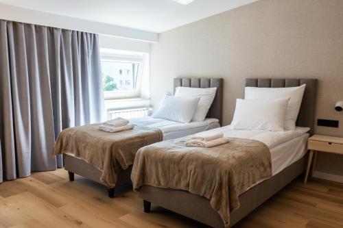 Katil atau katil-katil dalam bilik di Apartamenty Modra Warszawa