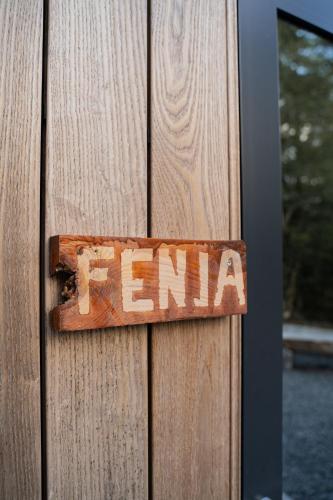 a wooden door with the word emma written on it at Vidsyn Midjås in Vistad