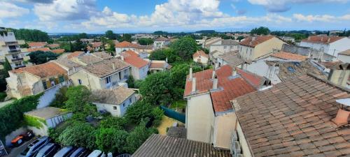 an aerial view of a town with roofs at KYRIAD ORANGE Centre Ville - HOTEL & RESTAURANT & BAR - La Galerie d'Art des Princes - Provence Alpes Côte d'Azur - France - Proche A7-A9 - exit21- Châteauneuf-du-Pape Avignon Bollene Nimes - 24h-24h in Orange