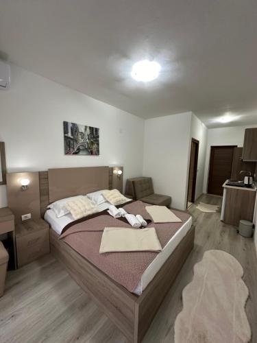 a bedroom with a large bed in a room at Apartments Amar in Ulcinj