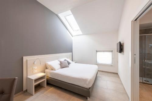 Una cama o camas en una habitación de Hotel Vecchio Casello