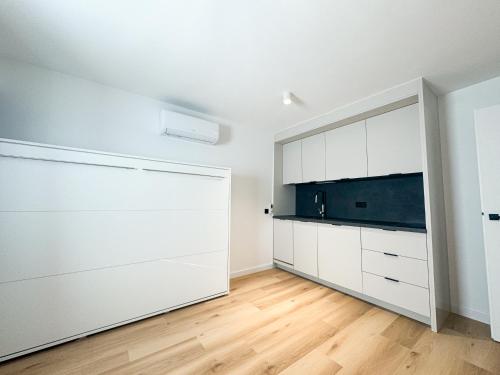 Dapur atau dapur kecil di Apartamenty Modra Warszawa