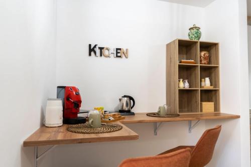 a kitchen with a table with a coffee maker on it at Stanze di Puglia in Sannicandro di Bari