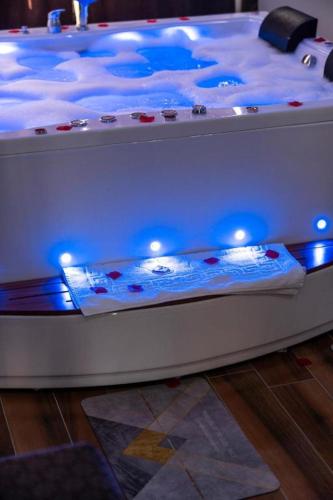 a bed with blue lights on top of it at AYYA SUİT HOTEL in Eskihisar