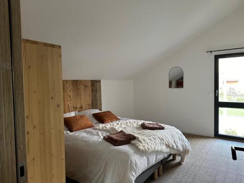 En eller flere senge i et værelse på Duplex 140m2 Villard-de-Lans