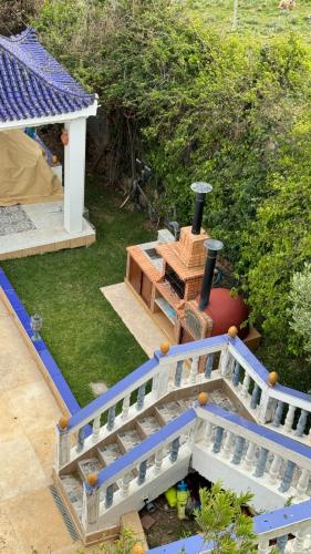 a model of a house with a wooden bridge at La Perla Montaña Tanger in Tangier