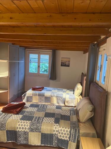 a bedroom with two beds in a house at Hamre Apartments (Nicholas) in Agios Georgios Pagon