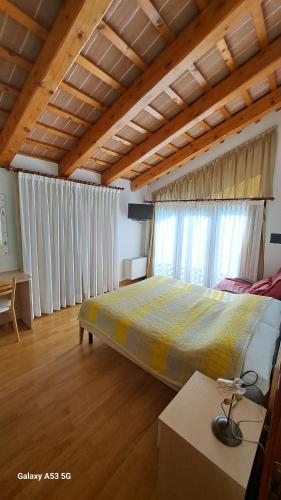 a bedroom with a large bed in a room at Country House Bucaneve in Rovolon