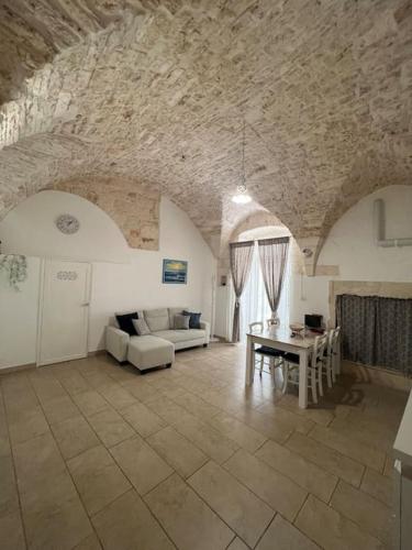 a living room with a couch and a table at Al Civico 33 in Martina Franca
