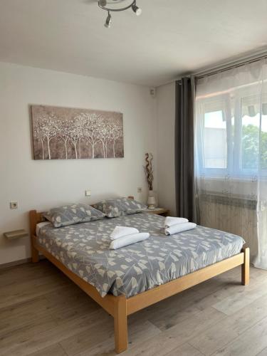 Postel nebo postele na pokoji v ubytování Apartments Marija