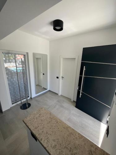 an empty kitchen with a counter and a refrigerator at Villa Anna in Premantura
