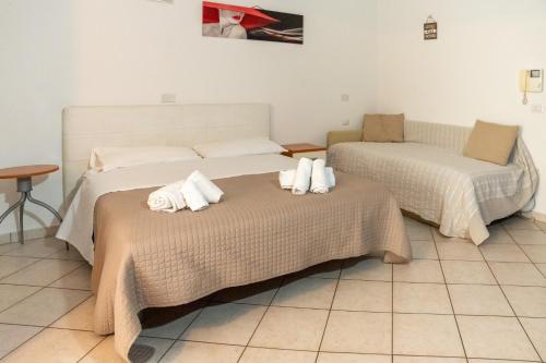 Ένα ή περισσότερα κρεβάτια σε δωμάτιο στο Residence Alessandra