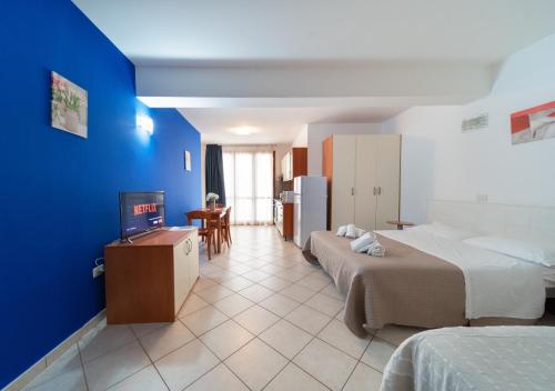Ένα ή περισσότερα κρεβάτια σε δωμάτιο στο Residence Alessandra
