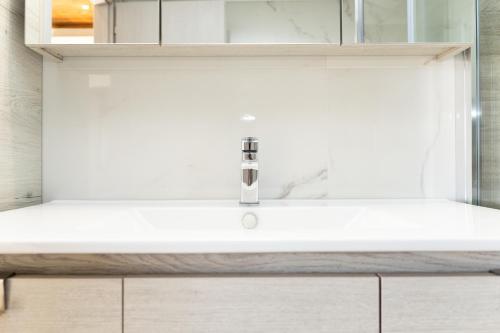 a bathroom sink with a white counter top at ArtView Villa in Syvota