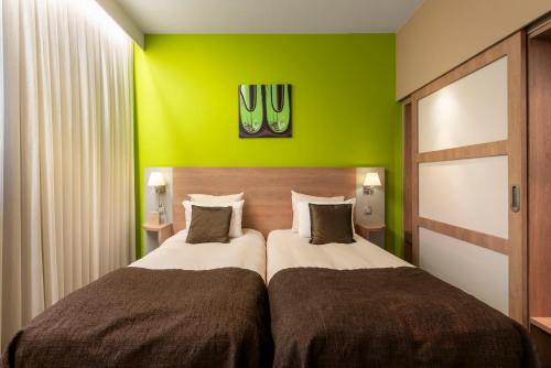 Cama o camas de una habitación en Van der Valk Waterloo