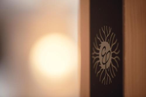 a light on the side of a wall at Engels Park in Vipiteno