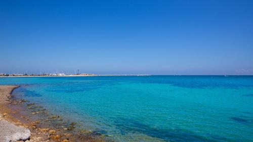 a view of the ocean from the shore of a beach at Casa Marineta III in Denia