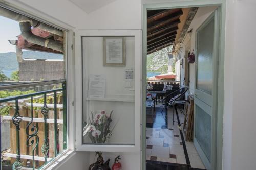 a view from the porch of a house with a balcony at Apartmani Zukic in Risan