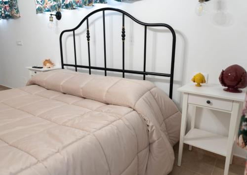 a bedroom with a bed and a white table at Stanze di Puglia in Sannicandro di Bari